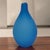 This vintage hand-blown satin glass blue Italian teardrop form bud vase exudes a mid-century modern style with its elegant...
