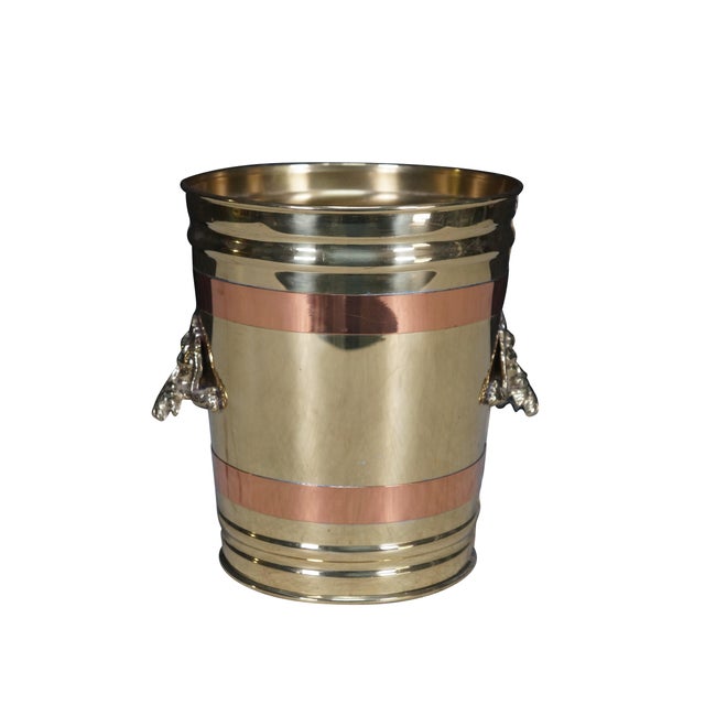 Vintage wine / champagne / ice bucket / trash bin. Made from brass with copper bands and figural handles showing the face...