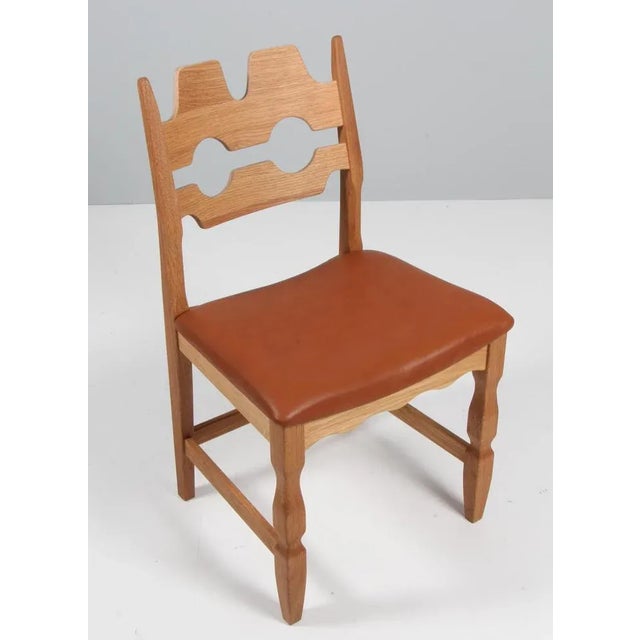 A striking dining chair by Henning Kjærnulf, made of oak and ready for you to upholster Refreshing design with bold...