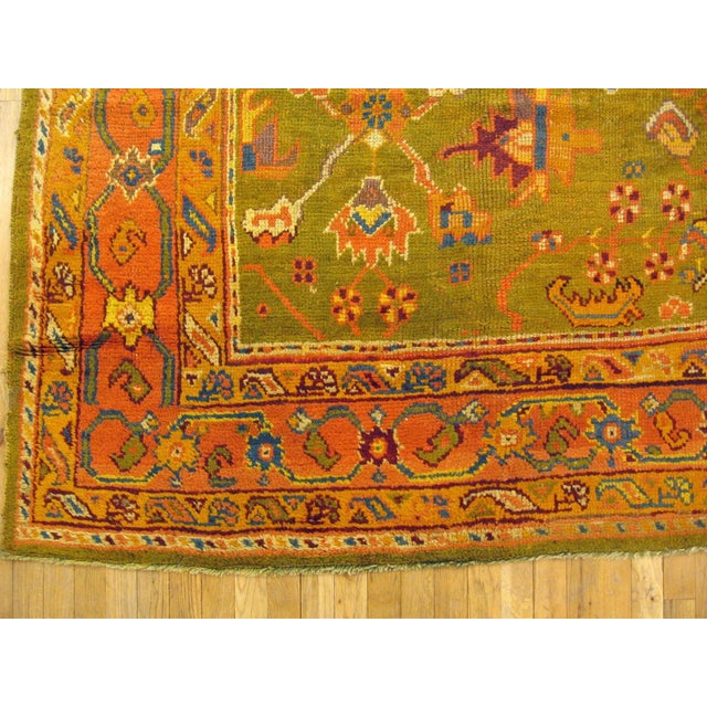 An early 20th Century Antique Turkish Oushak rug in a rare apple green tone