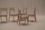 Elegant set of six Danish modern dining chairs from the 1960s, beautifully restored and professionally reupholstered in a...