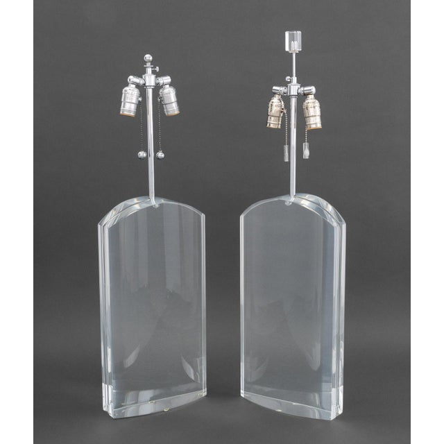 Pair of Modern Clear Acrylic and Chrome Table Lamps, one with cube form finial. Taller: 31.5" H x 9" W x 4" D. Provenance:...