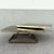 55.5”w when fully opened Striking Art Deco coffee table featuring a sculptural brass-tone base with a sleek geometric...