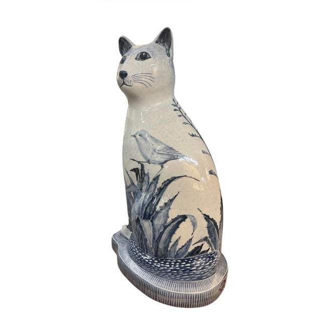 Charming vintage Italian ceramic sculpture of a seated cat, hand-painted in a classic blue and white palette. The body...
