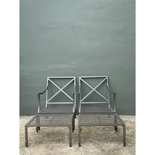This pair of vintage McKinnon and Harris cast aluminum chairs with matching ottomans showcases the maker's signature...