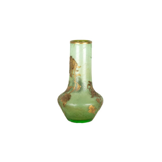 An early 20th-century Art Nouveau soft green glass vase, by Montjoye, France. This vase features a soft translucent green...