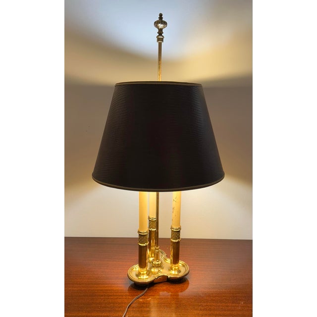 An absolutely stunning vintage Bouillotte table lamp in solid brass. Original shade and finial. This was made in the USA...