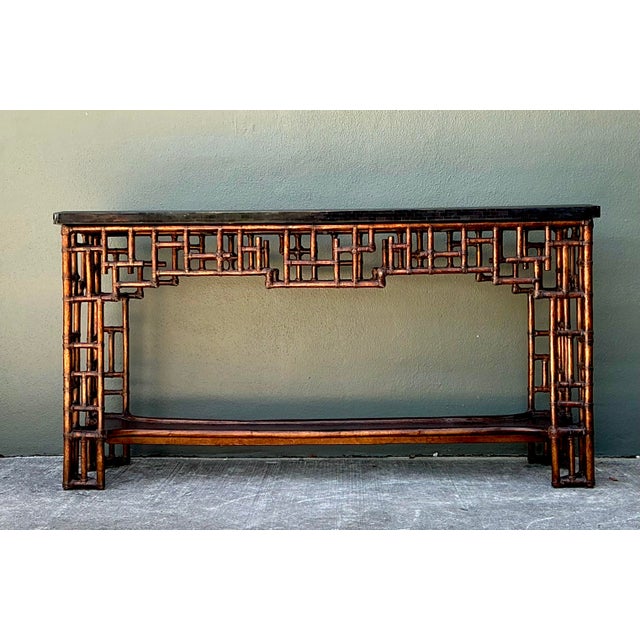 This striking vintage console table by Lexington is a masterpiece of Chinoiserie design, blending architectural rigor with...