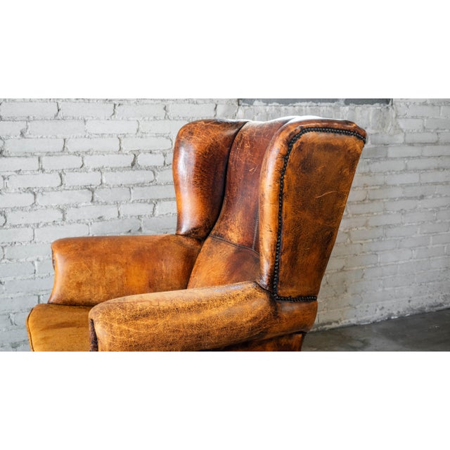 1970s Vintage Art Deco Distressed Cognac Leather Wingback Chair & Ottoman For Sale - Image 9 of 16