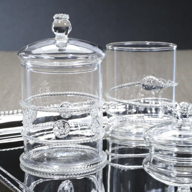 Crafted from high-quality borosilicate glass, the Juliet Lidded Glass Jars offer both elegance and functionality. This set...
