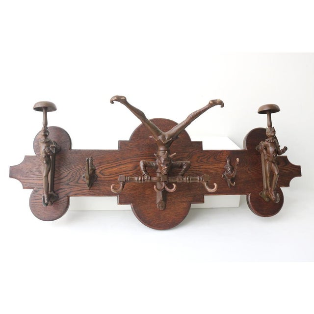 Add a touch of theatrical charm to your home with this unique Victorian-era wall coat rack, handcrafted from solid oak....
