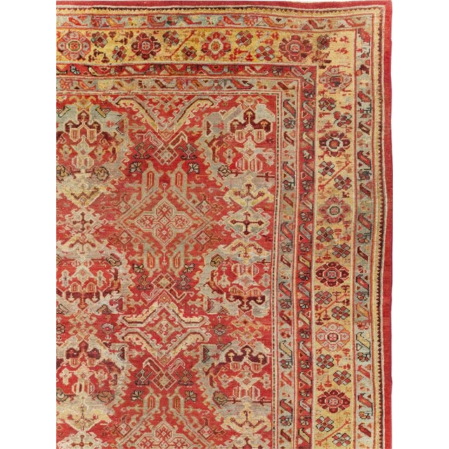 An antique Turkish Oushak large room size carpet handmade during the Early 20th century. Measures: 12' 3" x 16' 8"