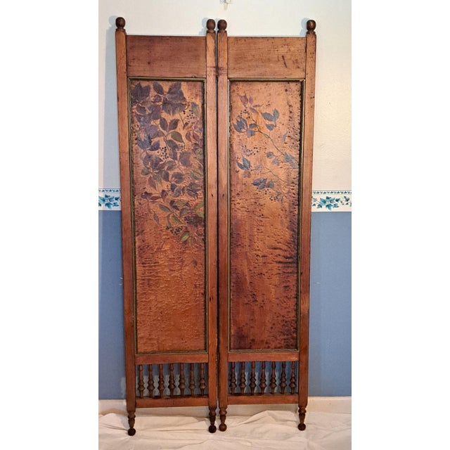 Beautiful antique 2-panel wooden folding screen with hand-painted leaf motif and a warm, richly aged finish. The panels...