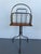 This is a really delightful revolving book or magazine stand in brass with oak wood platform. It is likely of English...