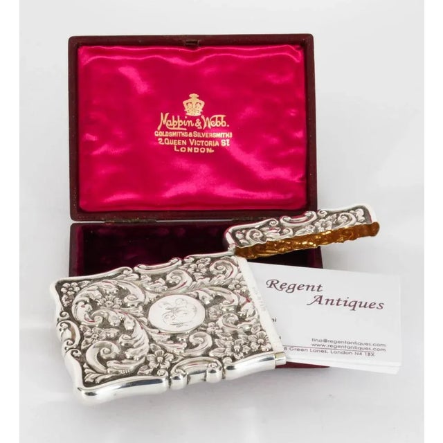This is a stylish antique Edwardian sterling silver card case with hallmarks for Birmingham 1904 and the makers mark of...