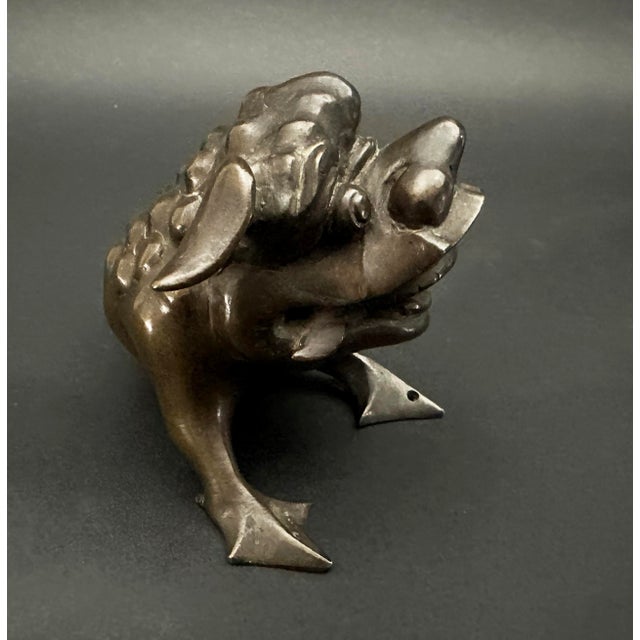 Bronze Foo Dog figurine from 18th Century China. In traditional Chinese culture, Foo dogs are guardians placed outside of...