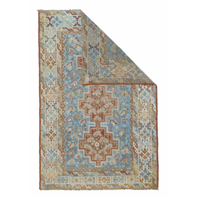 This Shiraz-area tribal scatter presents a red, chicken-filled, tripartite pole medallion, set on a light blue field with...