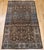 "A late 19th century Persian Farahan area rug, hand-knotted in camel hair with an elegant allover botanical design. The...