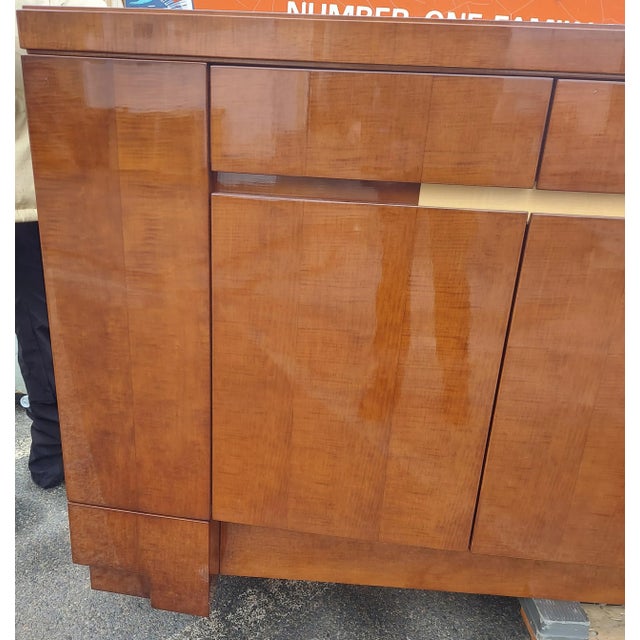 Designer custom made mahogany glass top credenza is in great condition. The glass has a couple of scratches. No chips or...