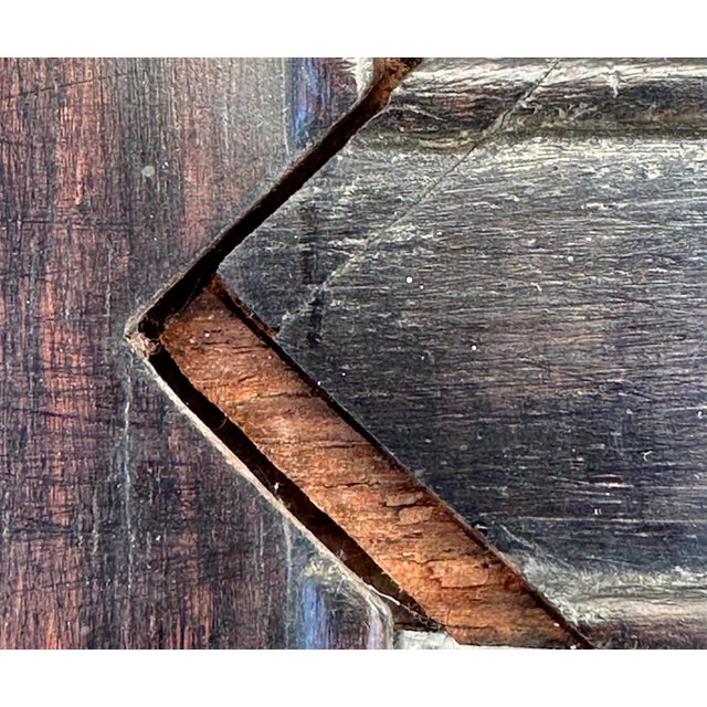 This pair of early 20th century Chinese armchairs has traditional mortise and tenon joinery. The seats float in their wood...