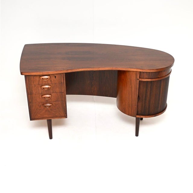 An absolutely spectacular Danish vintage desk. Designed in 1954, this was made in Denmark by Feldballes Mobelfabrik in the...