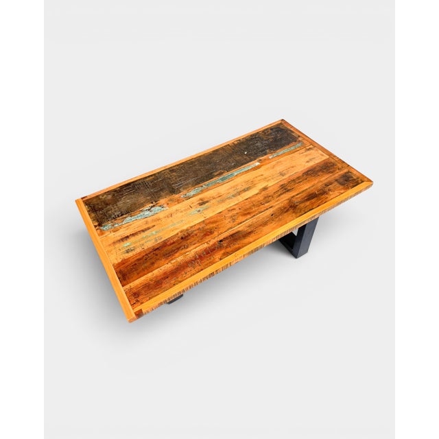 Industrial-style coffee table by MDesign, combining a tabletop made from reclaimed wood with a solid powder-coated steel...