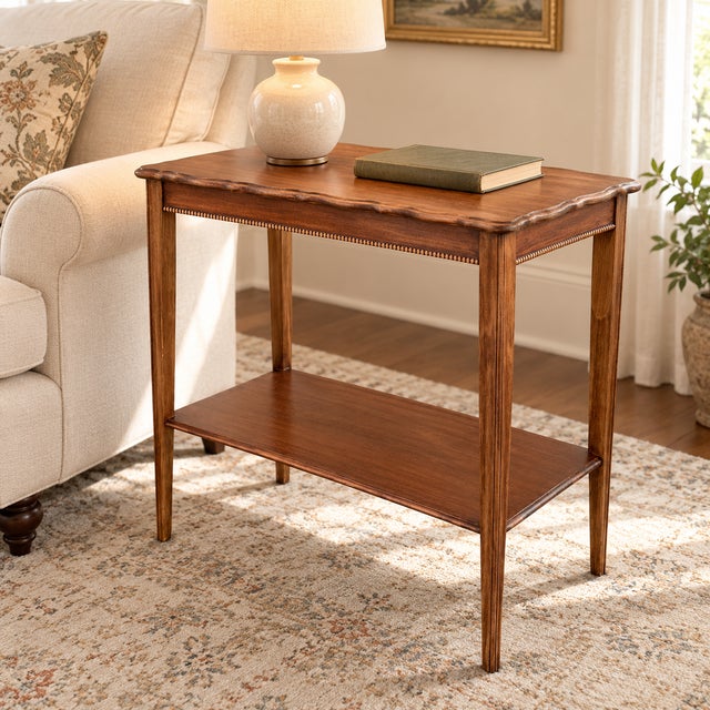 This vintage solid mahogany side table combines graceful traditional detailing with a practical two-tier design. A...