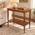 This vintage solid mahogany side table combines graceful traditional detailing with a practical two-tier design. A...