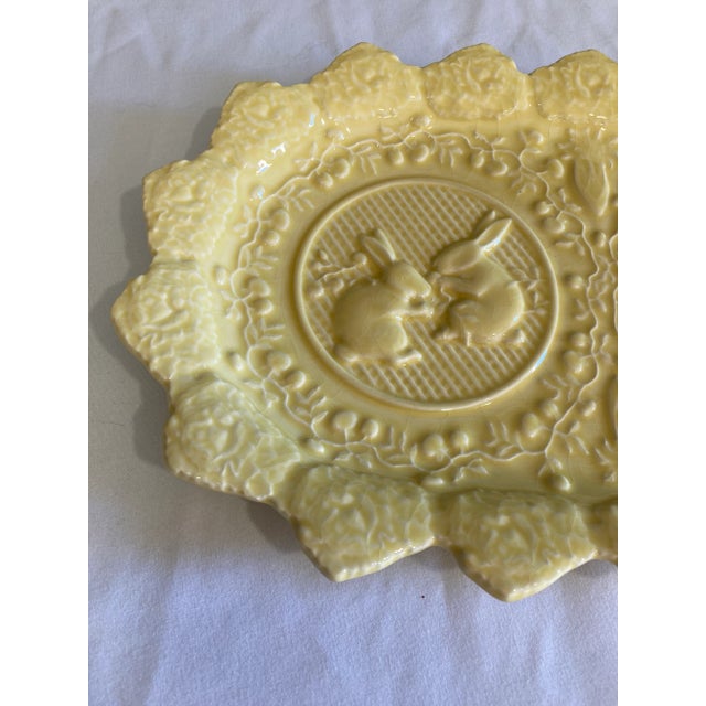 Very pretty and whimsical ceramic platter. Bunny designs with triangular edge pattern surrounding the plate. Made in...