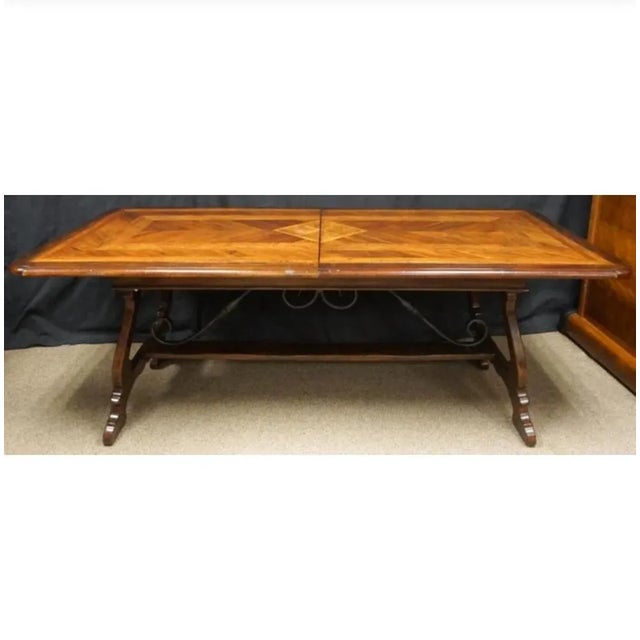 A stunning heavy parquetry dining table. Extendable with two self contained leaves of 16 inches each. Amazing banded and...