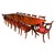 This is an elegant dining set that comprises an antique Regency Revival triple pillar dining table, by the renowned...