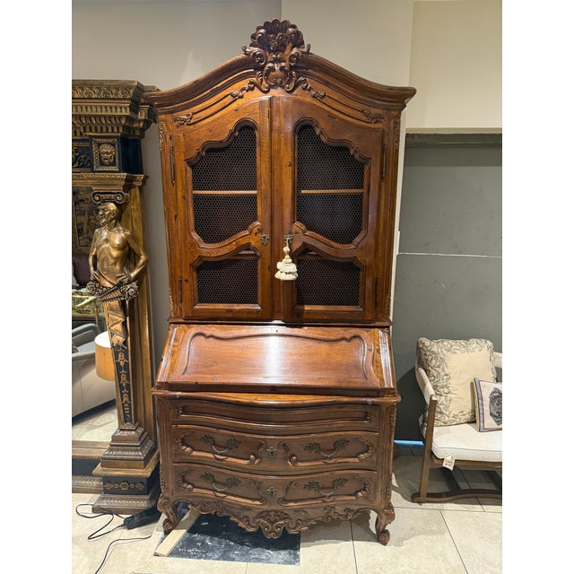 Hand carved Walnut Secretaire desk made in Italy in the French Style, Elegant and Stately this piece is as beautiful as it...