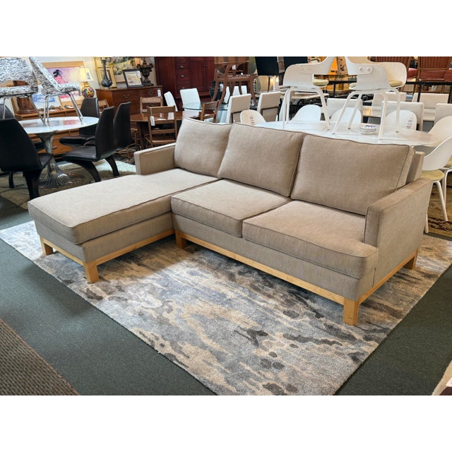 Design Plus Gallery presents Chaise Lounge Sectional from C & L Design. The sectional has a taupe tone of woven twill...
