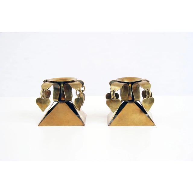 - A pair of Scandinavian candlestick holders - Completely made of brass - The base has been designed in the form of an...