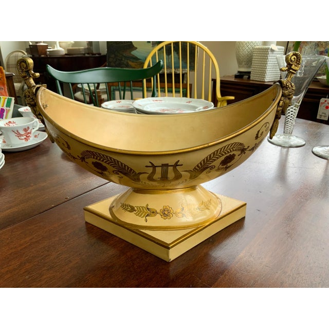 Late 20th Century French tole compote. Painted floral and musical decoration. Brass figural decoration.