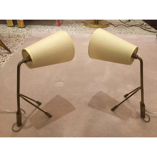 Boris Lacroix pair of wonderful vintage and original brass tri-pod table lamps, circa 1950. The small rings can also be...