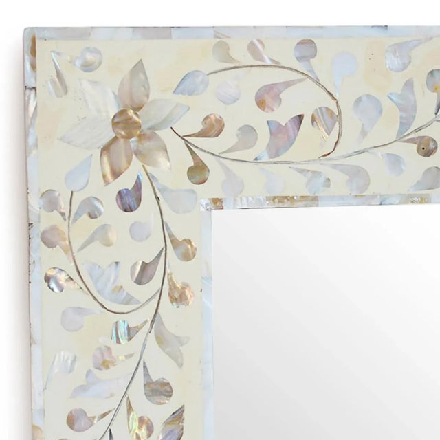 Beautiful vintage mother of pearl inlay mirror. Hand cut floral mother of pearl design on cream tone resin ground. Each...
