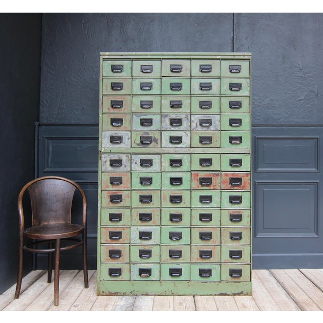 Early 20th century industrial metal drawer cabinet with great patina. Made in quality sturdy design with 60 drawers, each...