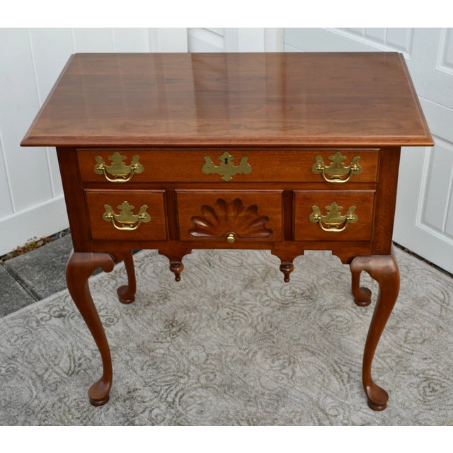 Vintage (1980's) Lowboy has a Queen Anne Style. The Wood is Mahogany. The Lowboy has Four Drawers and a Shell Motif. The...