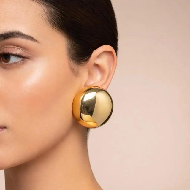 This exquisite pair of 1970s Italian clip-on earrings perfectly captures the bold, sculptural elegance of vintage European...