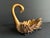 Heavy resin swan shaped decorative bowl. Gold with black feet. 10” x 6” x 8”. Weighs 3 pounds, 3.4 ounces.