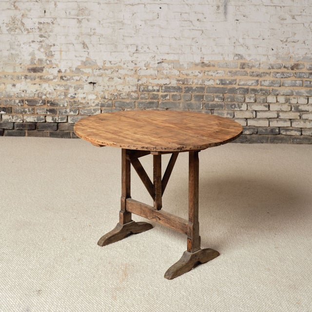 This 19th century French oak table de vin is a charming and versatile antique, crafted from solid oak with a beautifully...