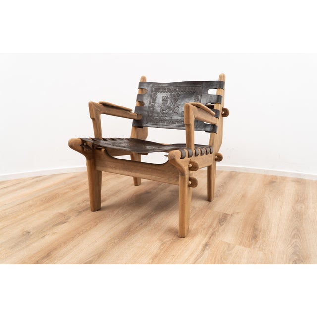 Lounge chair by Angel Pazmino for Muebles de Estilo. The chair is made out of wood and features interlocking joints, held...
