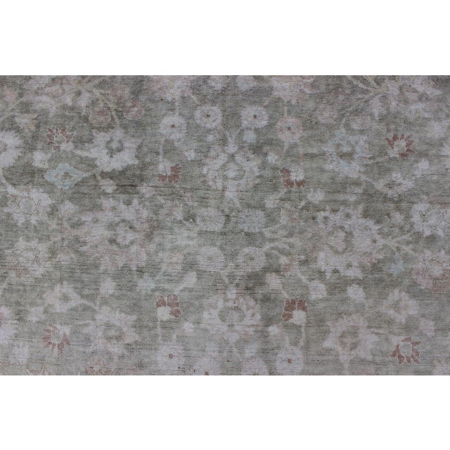 Early 20th Century 1930's Vintage Turkish Muted Oushak With All-Over Floral Design and Border For Sale - Image 5 of 10