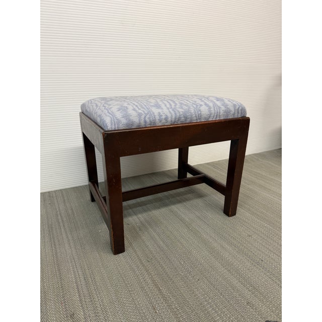 Design Plus Gallery presents an Early 20th Century Chippendale Footstool. The dark finish wood compliments the baby blue...