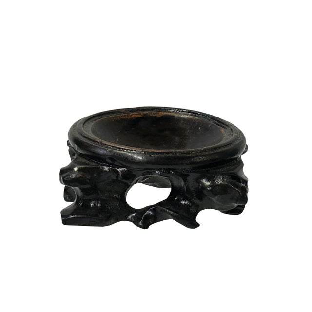 This is a handmade Chinese accent decorative display stand made of dark brown stained wood with irregular stem-like...