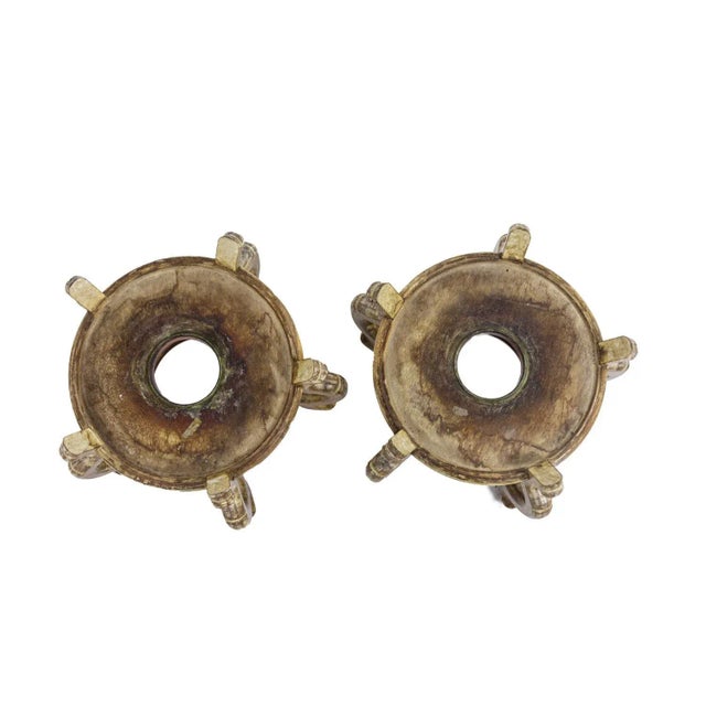 Pair of armchairs with medallion back in gilded wood and acanthus leaf decoration. Armrests with cuffs recessed from the...