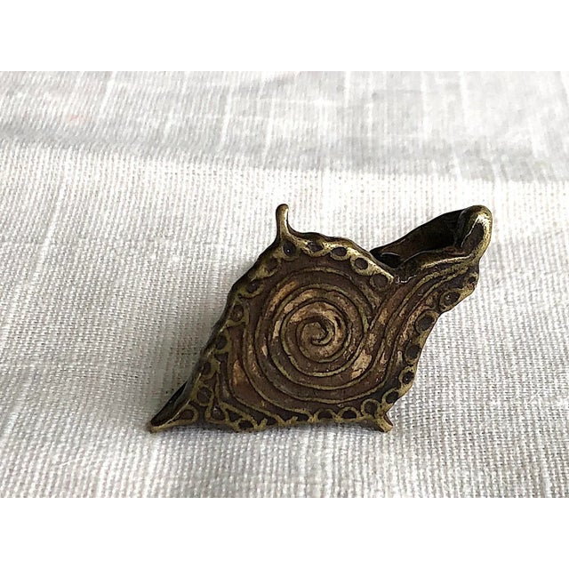 Antique bronze Hindu body stamp is a small work of art. The small vintage bronze Indian chhapas has a spiral radiating...