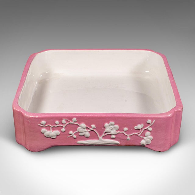 This is an antique cheese wheel dish. An English, ceramic decorative butter tray, dating to the Victorian period, circa...