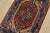 A traditional tribal Heriz rug hand-knotted with fine wool on a cotton foundation. This oriental rug features a central...